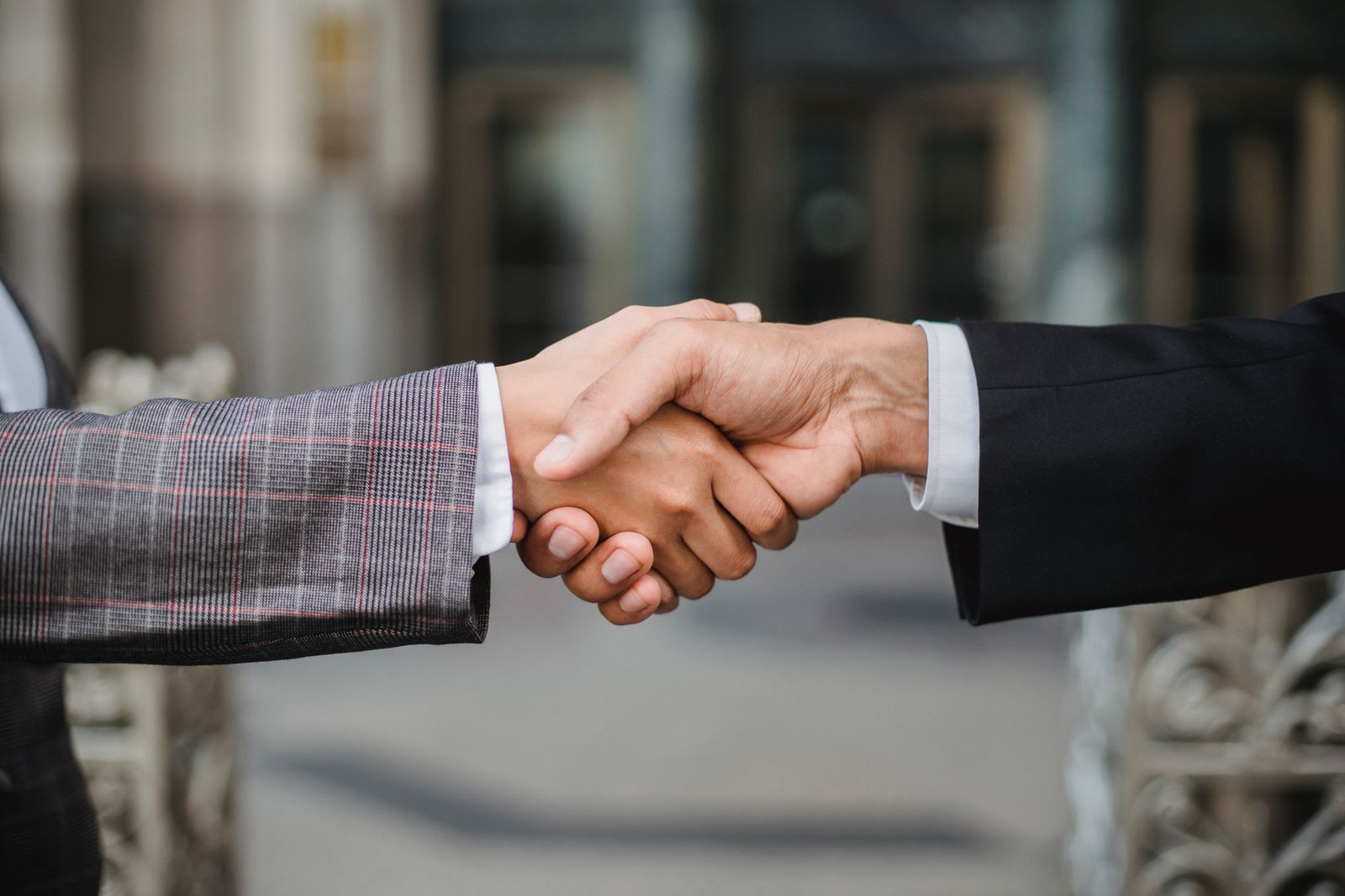 Two people shaking hands on a deal