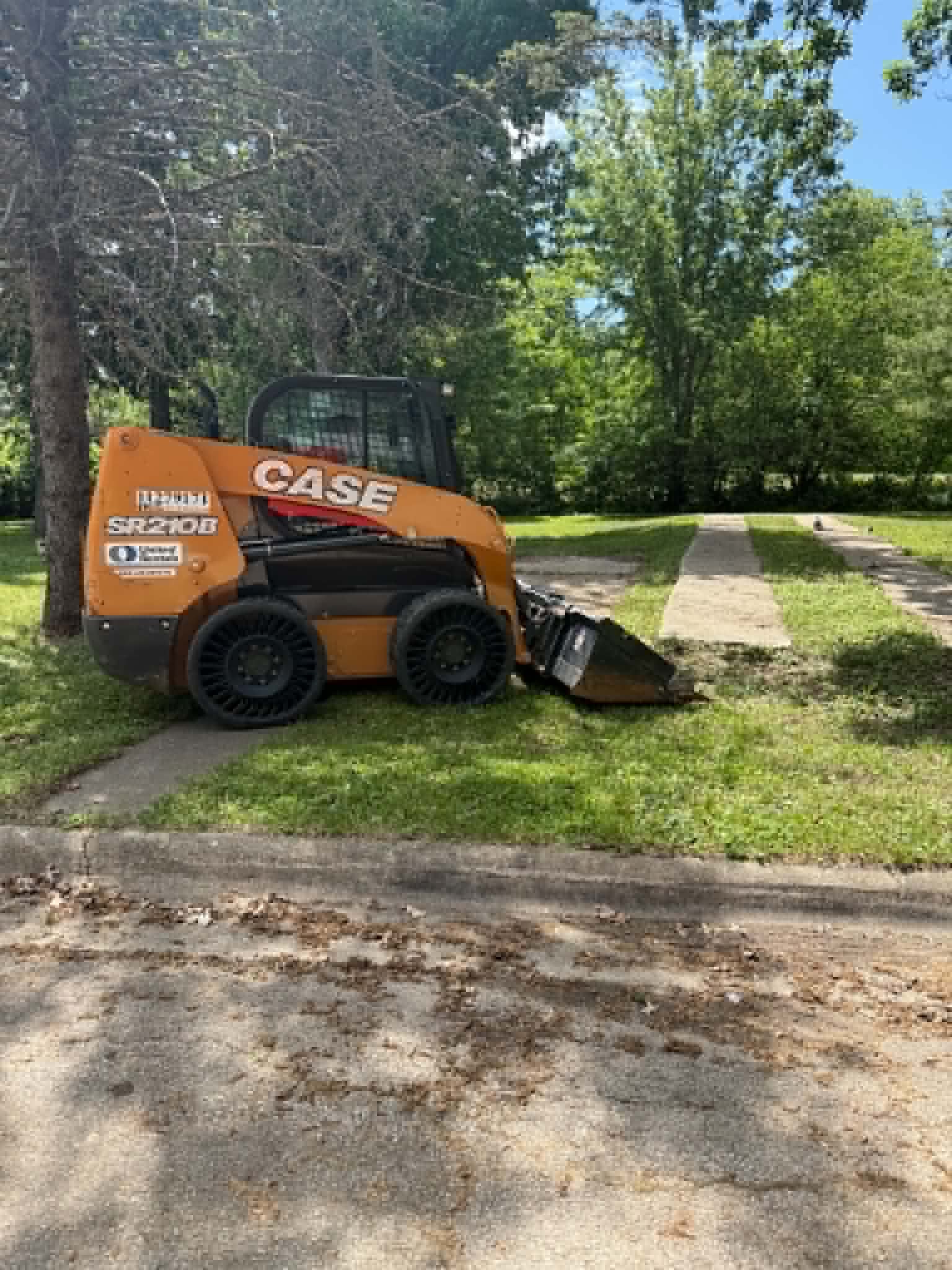 SetCo's own CASE skid steer on site for grading and site prep