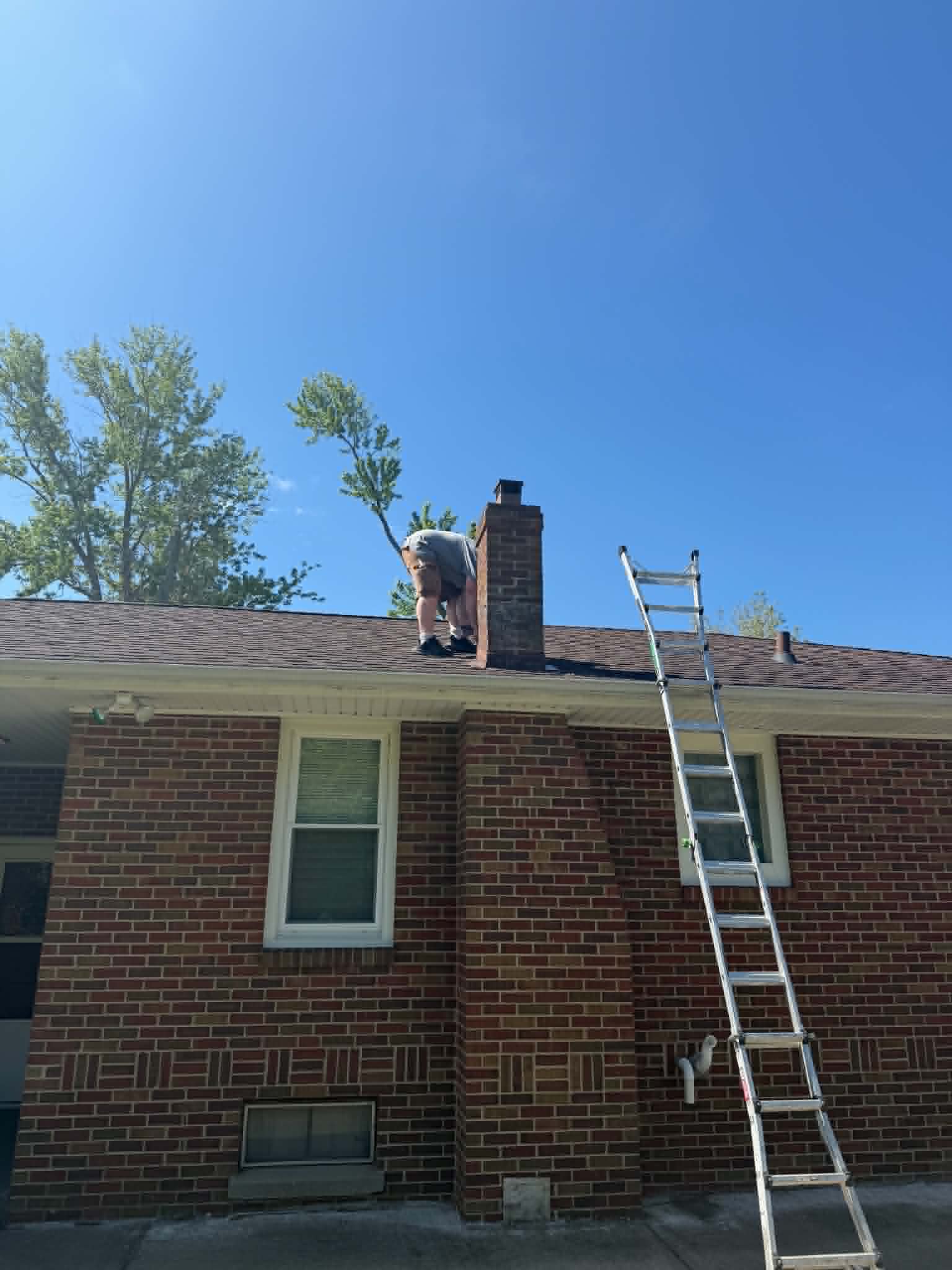 SetCo crew updating a roof and chimney during a full home rehab in Streator, IL